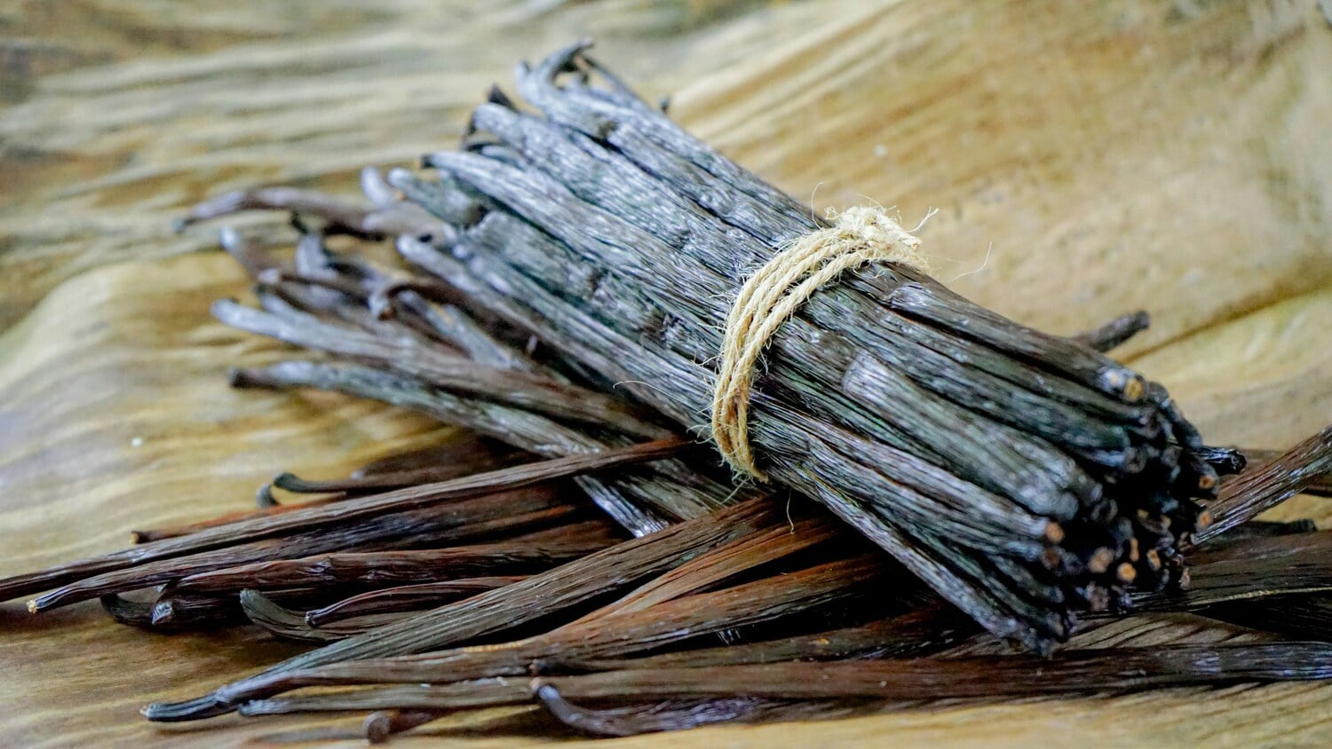 Premium Madagascar vanilla beans showing the characteristic dark specks of authentic vanilla